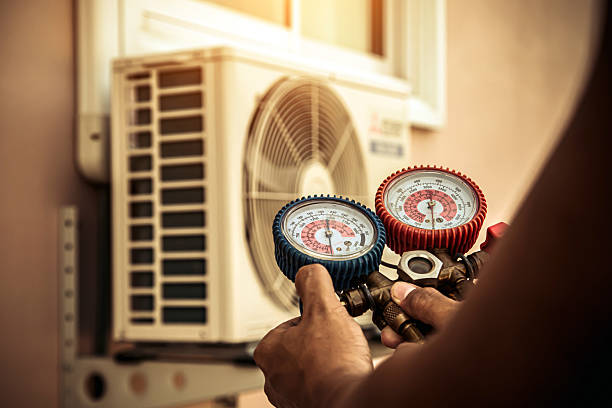 Professional Air Conditioning Service technician working in Seneca, KS